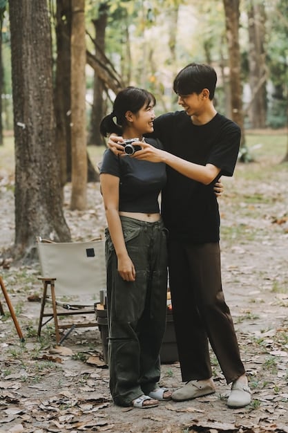 A still from a Korean independent film, showing a poignant scene with two characters engaged in a deep conversation in a dimly lit environment. The image should evoke a sense of intimacy and introspection.
