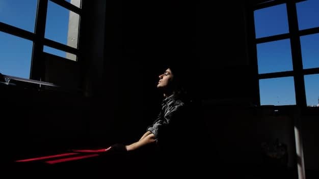 A scene from a suspenseful Korean drama, showing a character looking intensely at something off-screen, with dark and moody lighting to create a sense of mystery.