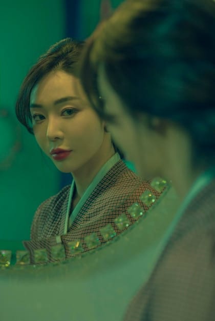 A split image showing a glamorous depiction of a doctor in a Korean drama on one side, and a tired, overworked doctor in a real hospital on the other, illustrating the contrast between the fantasy and reality of the profession.