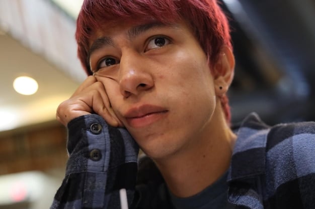 A close-up shot of a character in a Korean drama delivering a particularly emotional line, with expressive eyes and a slight tear rolling down their cheek.