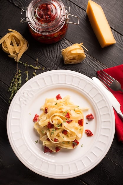 A beautifully plated dish of pasta carbonara featured in a popular Italian drama. The pasta dish is garnished with fresh parsley and served on a rustic ceramic plate with a glass of red wine in the background. Soft, natural light illuminates the scene, highlighting the creamy texture of the pasta and the vibrant green of the parsley.